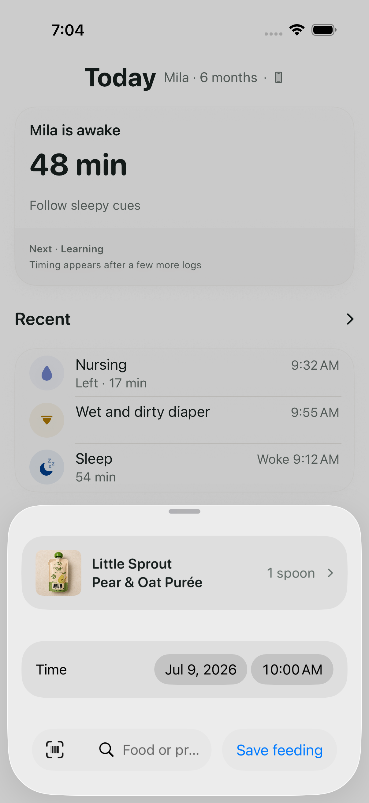 Mila food log with a pear and oat purée, its portion and controls to find or scan another food.